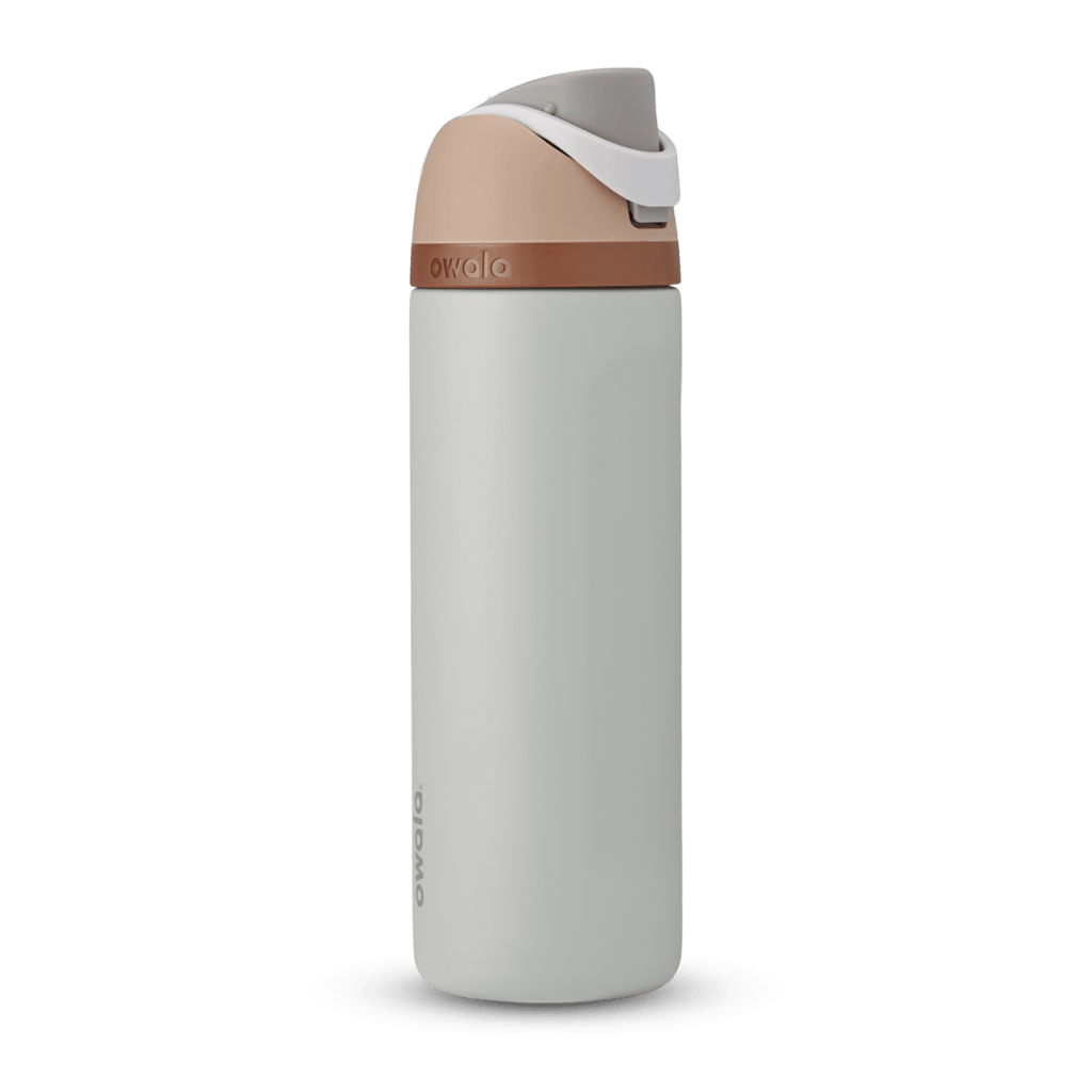 FreeSip 24oz in Calm Waters, pale gray body with peach flip cap, white carry loop, and copper accent band