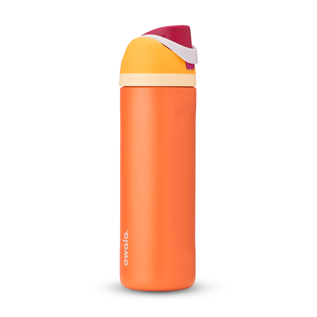 FreeSip 24oz in Citrus Crush, bright orange body with yellow flip cap, magenta carry loop, and cream accent band
