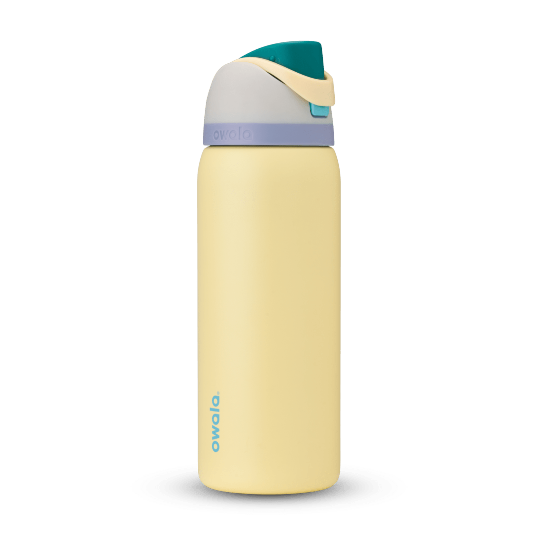 FreeSip 32oz in Sunny Daze, soft yellow body with teal flip cap, cream carry loop, gray lid, and lavender accent band
