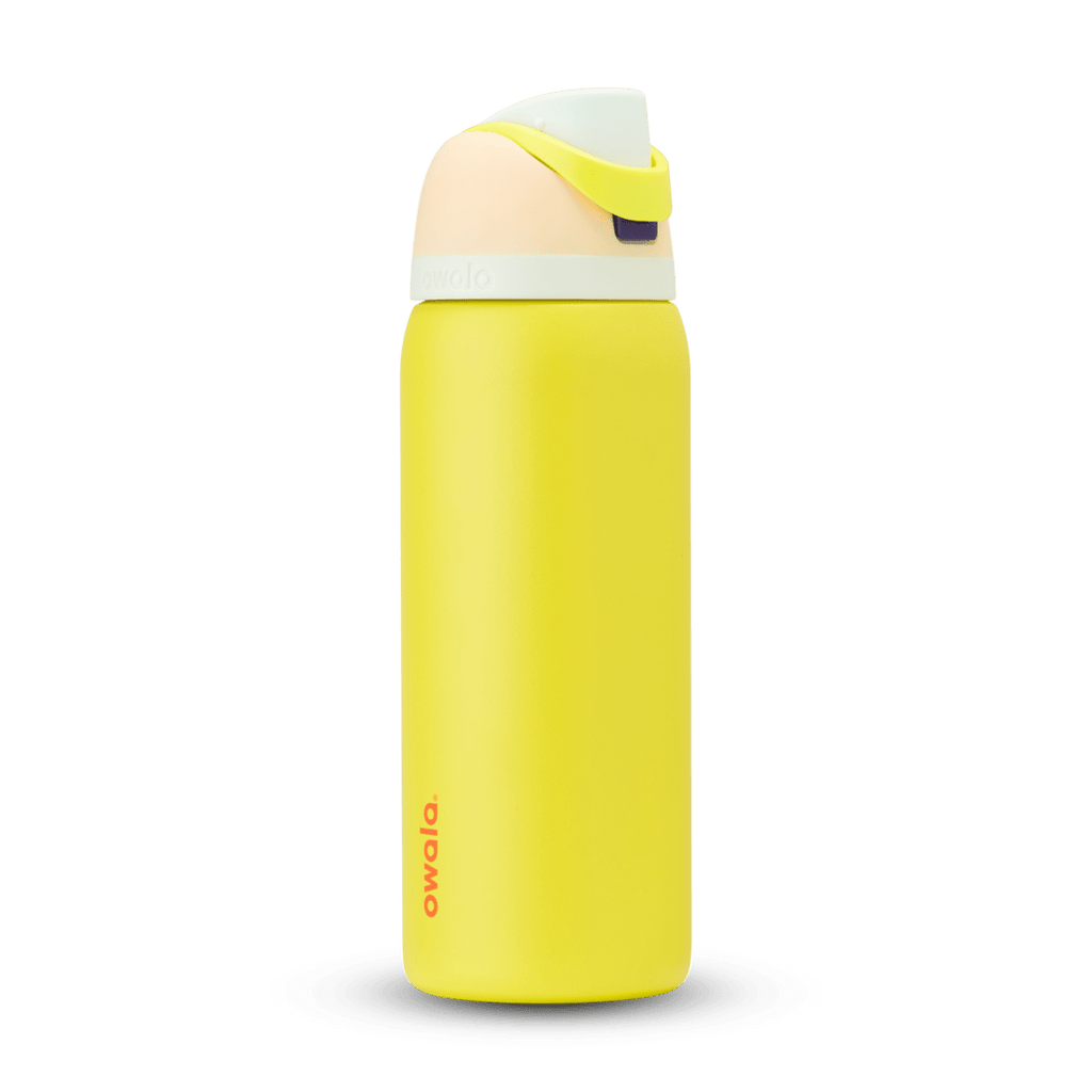 FreeSip 32oz in Lemon Limeade, bright yellow body with peach lid, neon yellow-green carry loop, white accent band, and orange logo