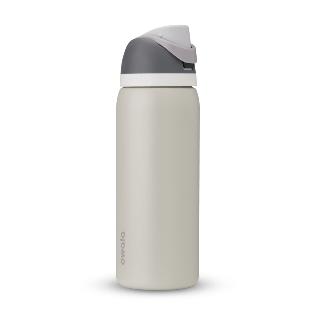 FreeSip 32oz in Rock On, cream stone body with dark grey flip cap, light grey carry loop, and white accent band