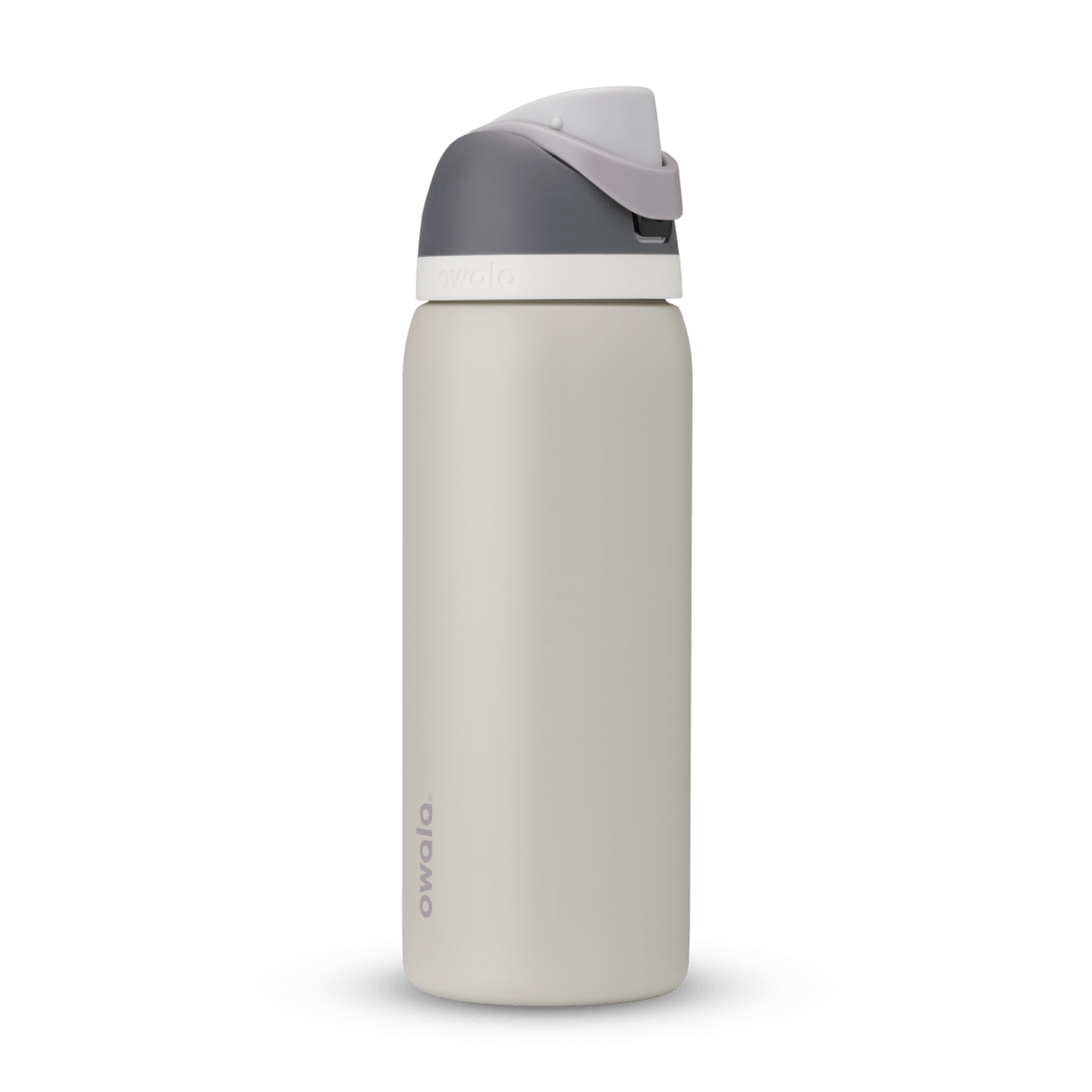 FreeSip 32oz in Rock On, cream stone body with dark grey flip cap, light grey carry loop, and white accent band