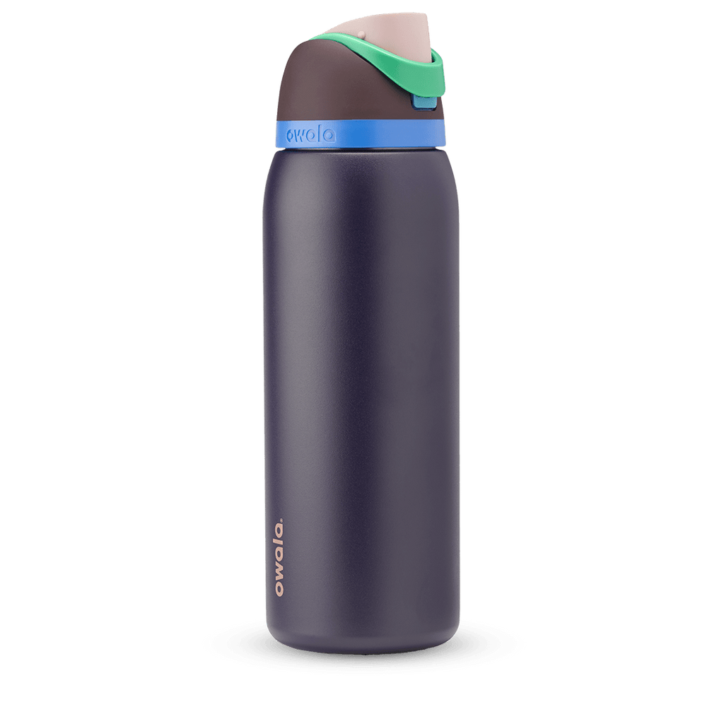 FreeSip 40oz in Night Safari, dark navy body with bright blue accent band, green carry loop, and brown flip cap