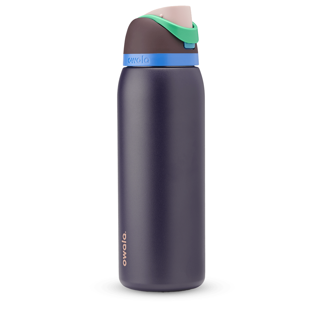 FreeSip 40oz in Night Safari, dark navy body with bright blue accent band, green carry loop, and brown flip cap