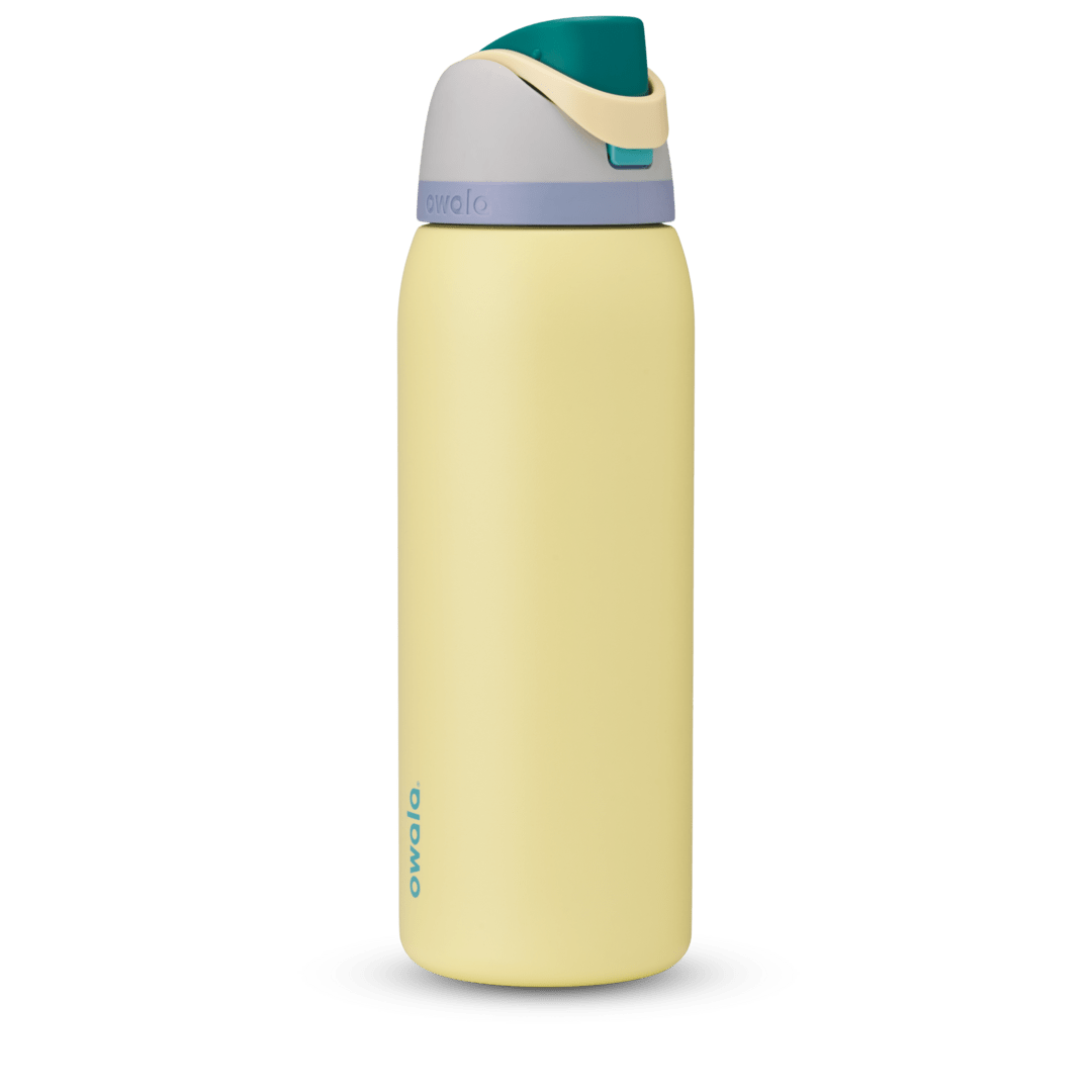 FreeSip 40oz water bottle, pale butter yellow body with teal, soft lavender, and tan color-block lid and flip cap
