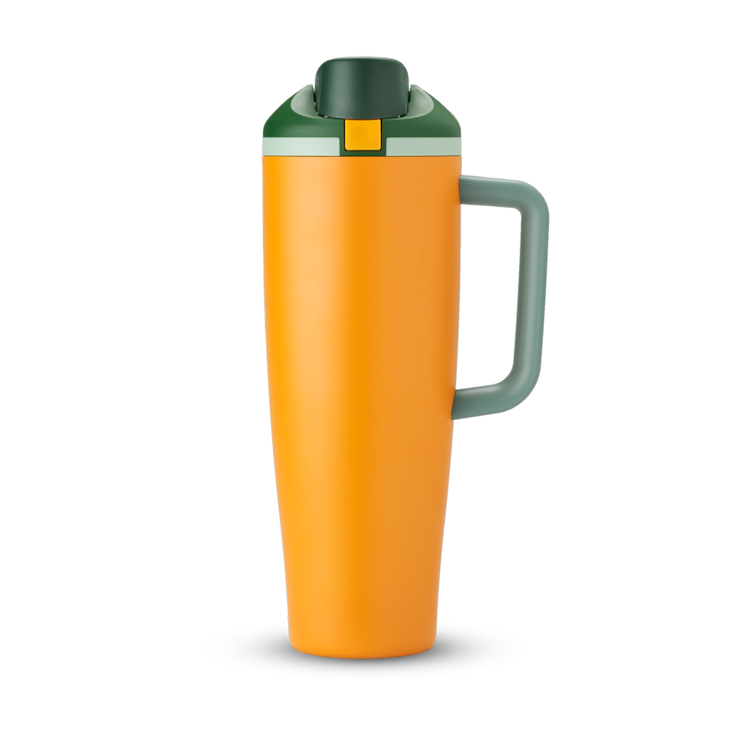FreeSip Tumbler 40oz in Orange Grove — bright orange body with dark forest green lid and orange handle, viewed from the handle side