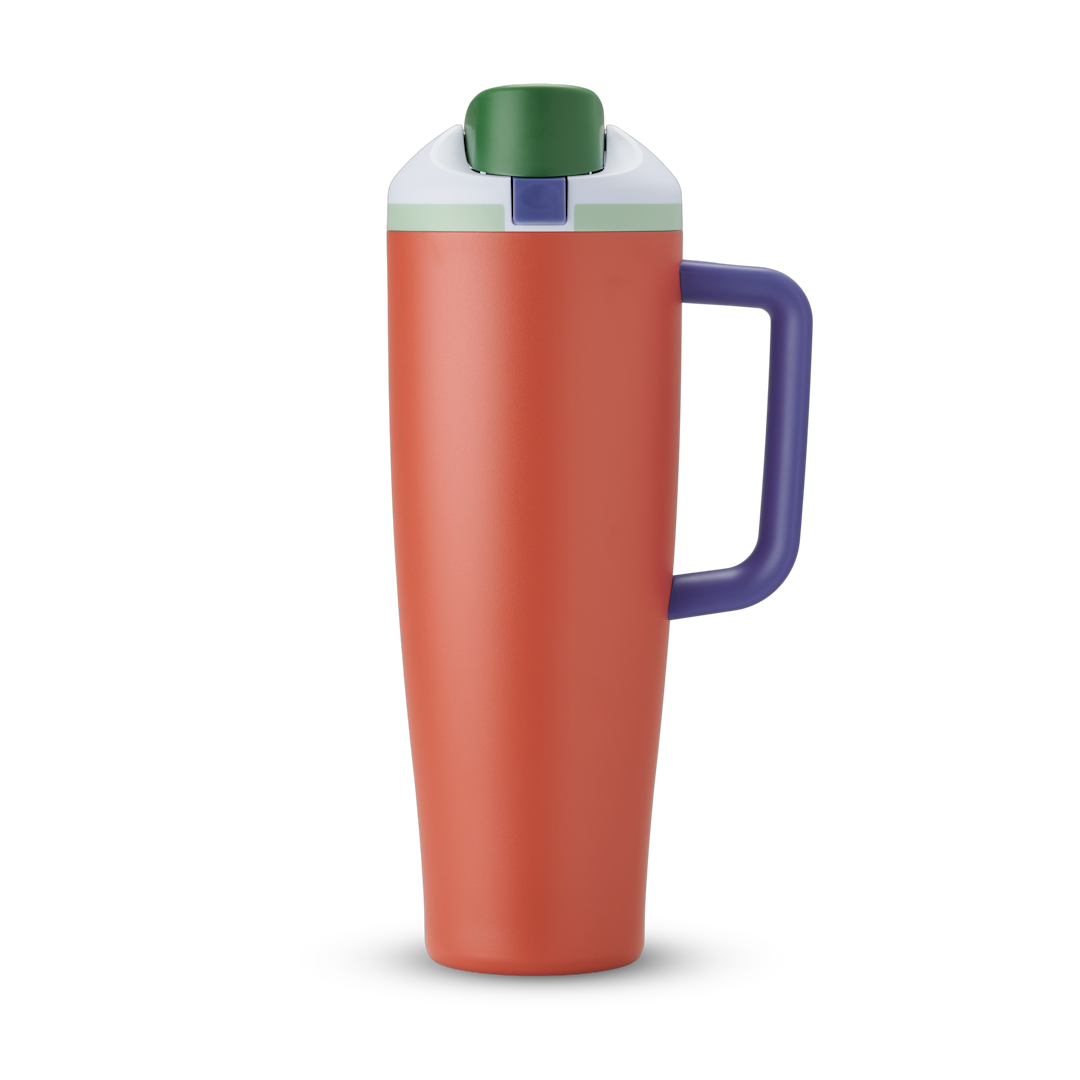 FreeSip Tumbler 40oz in Summer Harvest — terracotta/burnt orange body with dark green lid and purple handle, viewed from the handle side