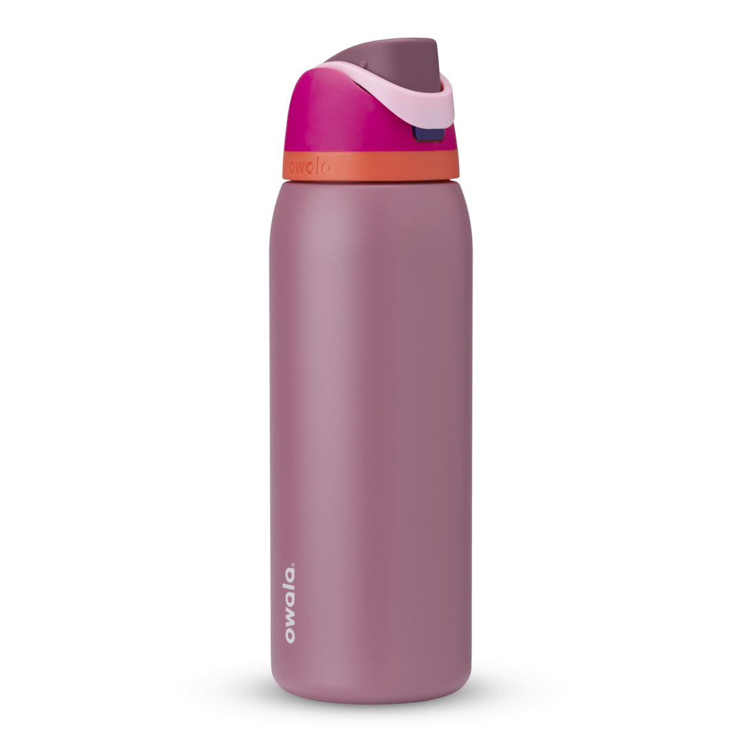 FreeSip 40oz in Crown Jewel, dusty mauve body with hot pink flip cap, light pink carry loop, and bright orange accent band