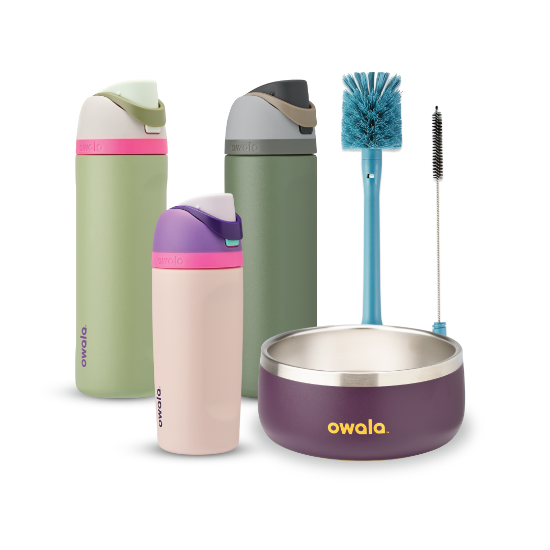 Family Bundle with accessories; two tall FreeSip water bottles in green and pink-mauve, a Kids Tumbler in pink-mauve with teal lid, a purple Pet Bowl with stainless rim, and a blue bottle brush