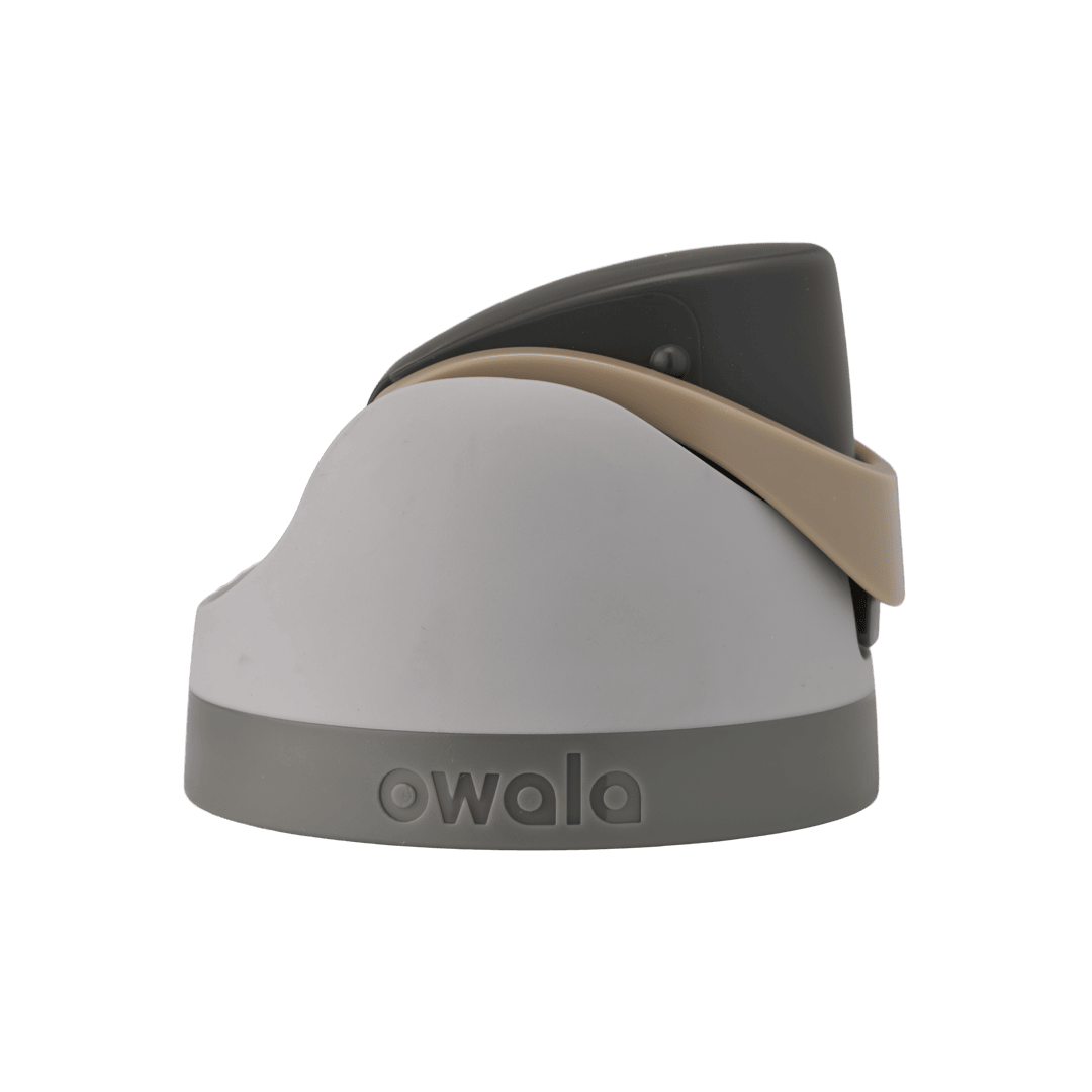 Owala FreeSip replacement lid in Green House, light gray body with dark charcoal flip cap, tan beige carry loop, and medium gray base accent band