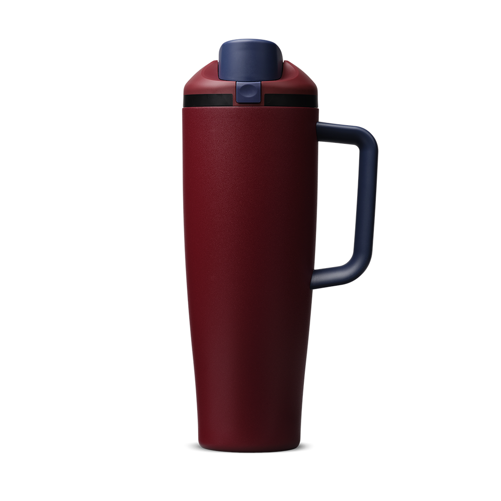 FreeSip Tumbler 40oz Burgundy Bay, deep burgundy red body with matching burgundy flip cap, navy blue push-button and lid, black accent band, and navy blue handle