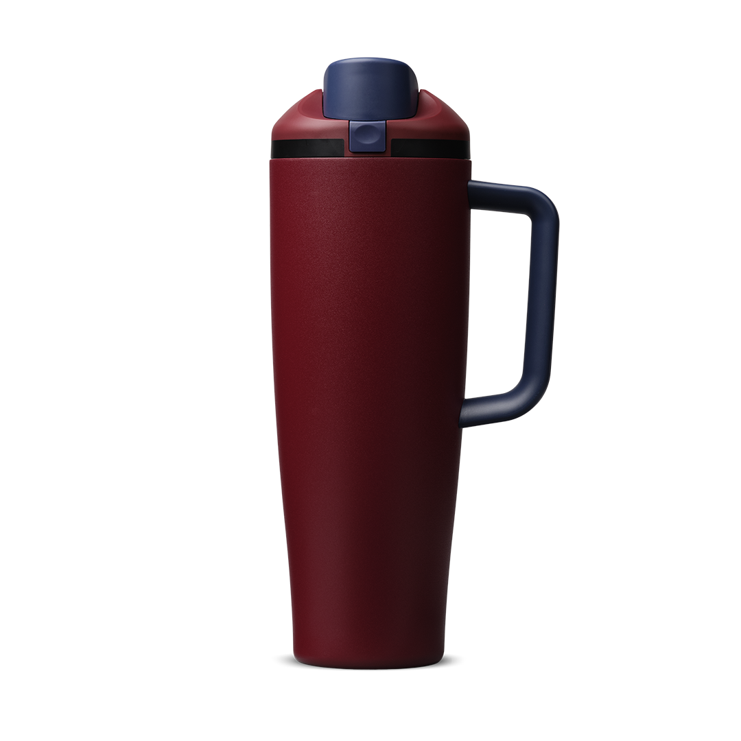 FreeSip Tumbler 40oz Burgundy Bay, deep burgundy red body with matching burgundy flip cap, navy blue push-button and lid, black accent band, and navy blue handle