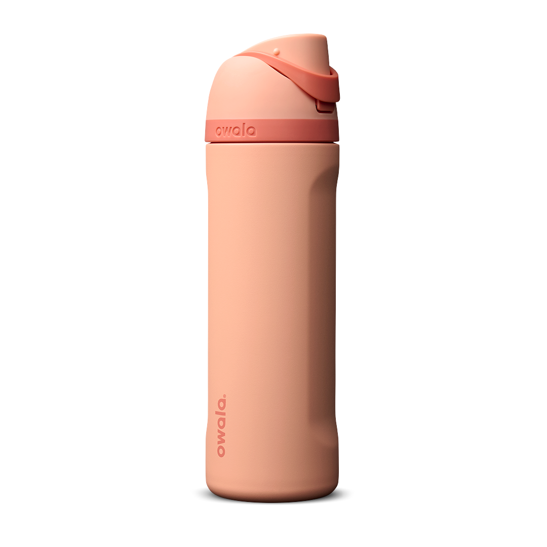 Owala FreeSip 24oz in Peach of Mind, soft coral peach insulated bottle with matching peach flip cap and carry loop