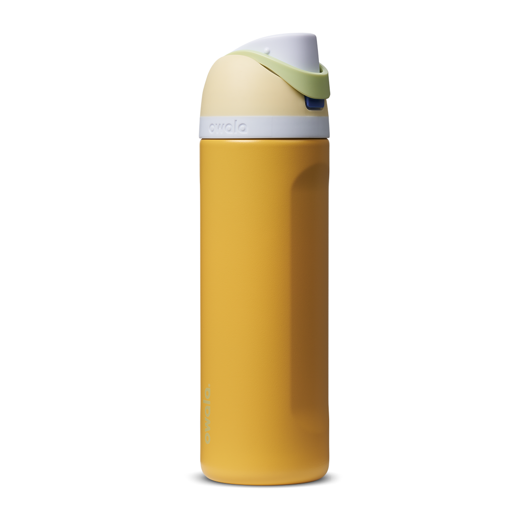 FreeSip 24oz in Treasure Hunt, golden mustard yellow body with cream white flip cap and green carry loop