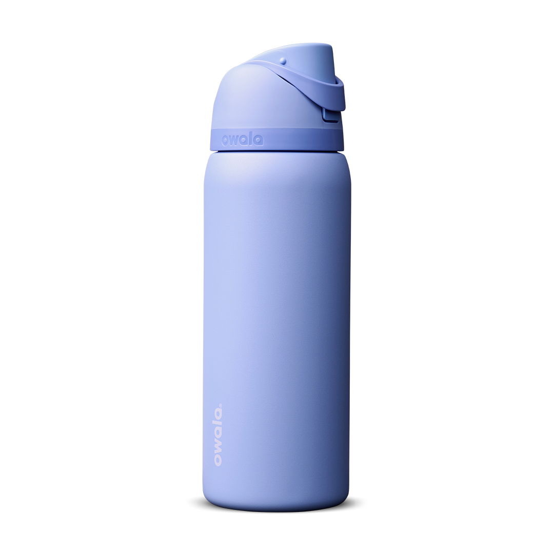 Owala FreeSip 32oz in Out of the Blue, periwinkle blue insulated bottle with matching blue-lavender flip cap and carry loop