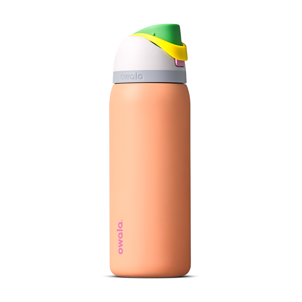 FreeSip 32oz in Peachy Keen, soft peach orange insulated bottle with white flip cap lid, yellow flip tab, and bright green carry loop