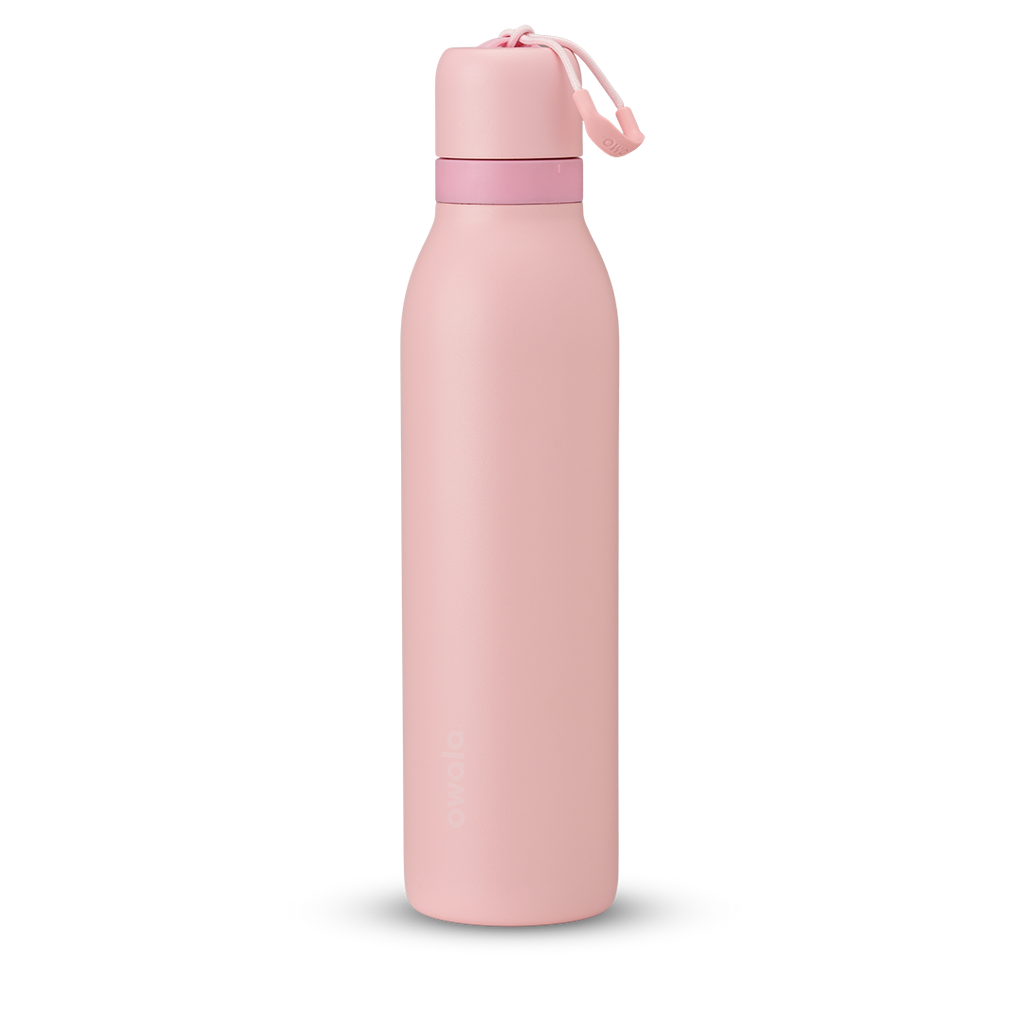FreeSip Twist 24oz in Rose Quartz, soft pink insulated water bottle with matching pink twist cap, light pink twist cap accent band, and pink carry string with grip