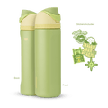 FreeSip 24oz in Tiana, olive green insulated bottle with cream flip cap, green carry loop, and pale yellow lid, shown front and back with included "Just One" lipstick kiss, water lily, "Follow Your Dreams" trolley, and green star stickers