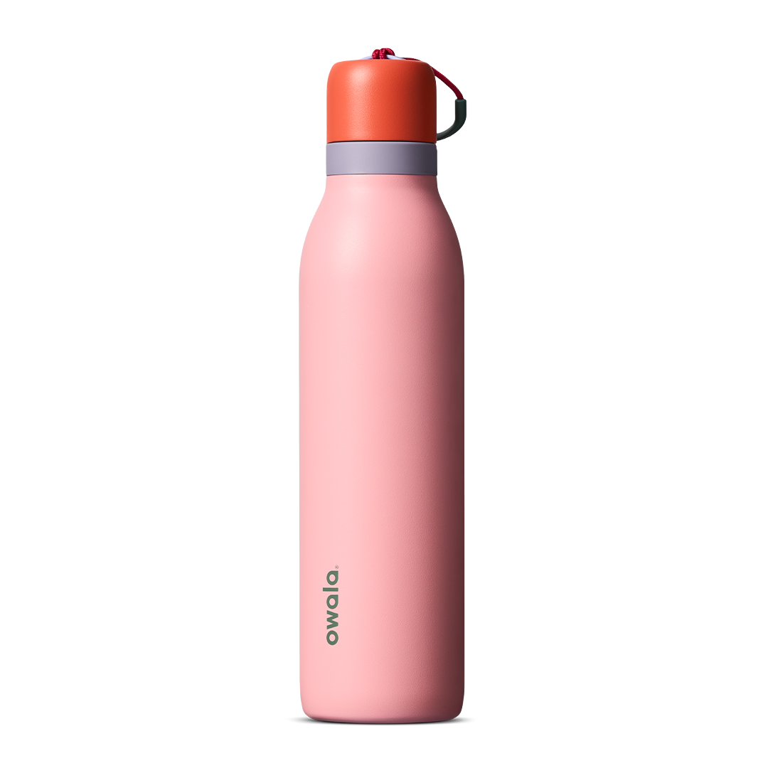 FreeSip Twist 24oz, coral pink body with orange-red lid and purple band; slim insulated bottle