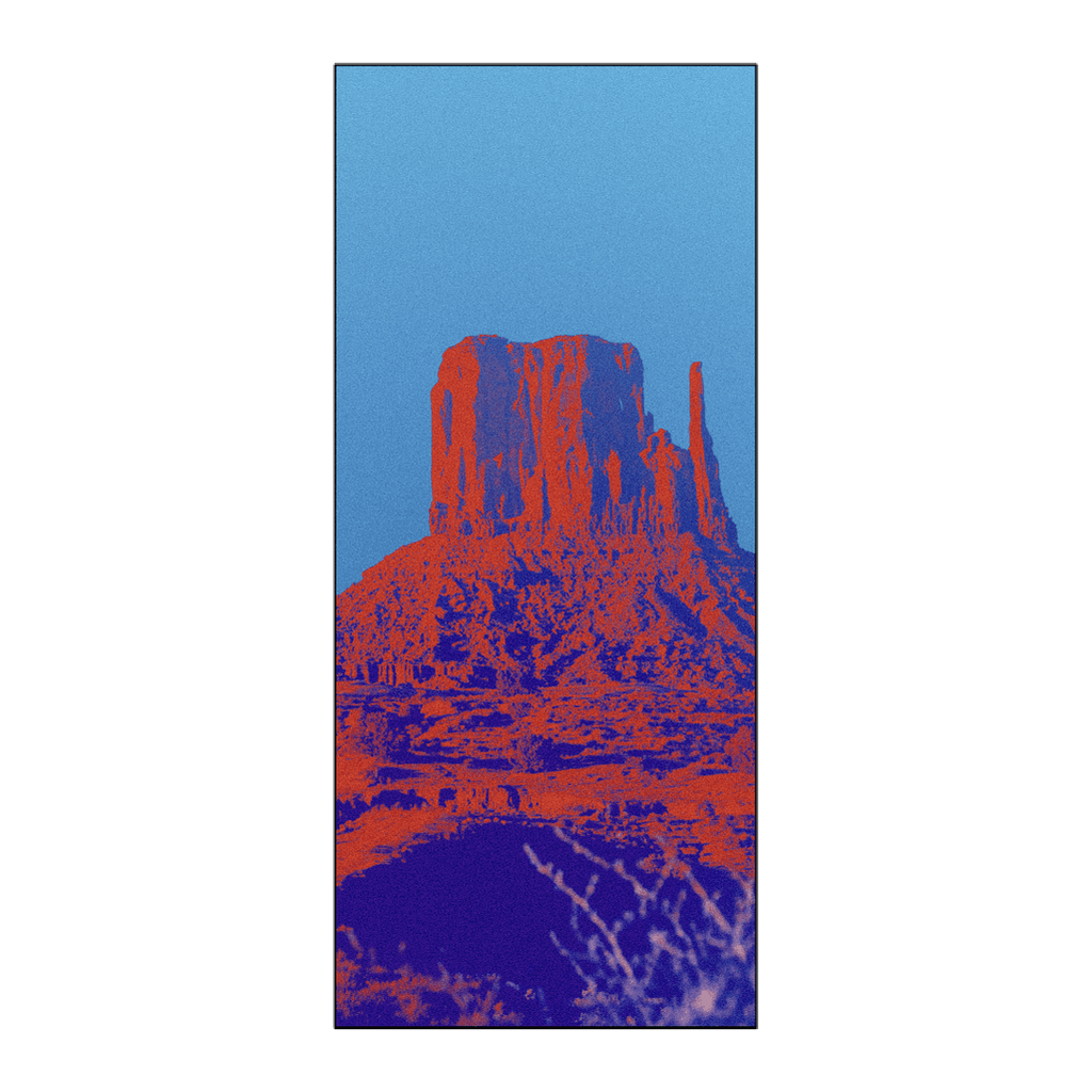 Owala Beach Towel in Wild Wild West; vibrant pop-art red and orange desert rock formation print on a bright blue background
