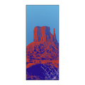 Owala Beach Towel in Wild Wild West; vibrant pop-art red and orange desert rock formation print on a bright blue background