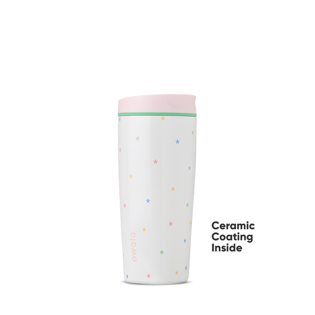 Owala Birthday Bash Give Me the Tea 20oz Tumbler in white scattered with tiny multicolor pastel stars, soft pink lid, and mint green accent ring