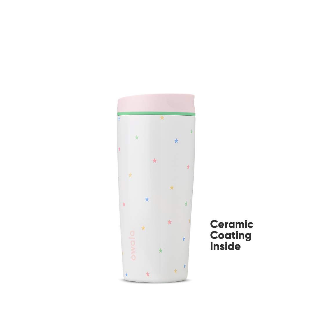 Owala Birthday Bash Give Me the Tea 20oz Tumbler in white scattered with tiny multicolor pastel stars, soft pink lid, and mint green accent ring